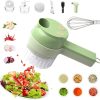 Green 4-in-1 electric vegetable cutter surrounded by accessories, whisk, and chopped ingredients including garlic, chili, and onion