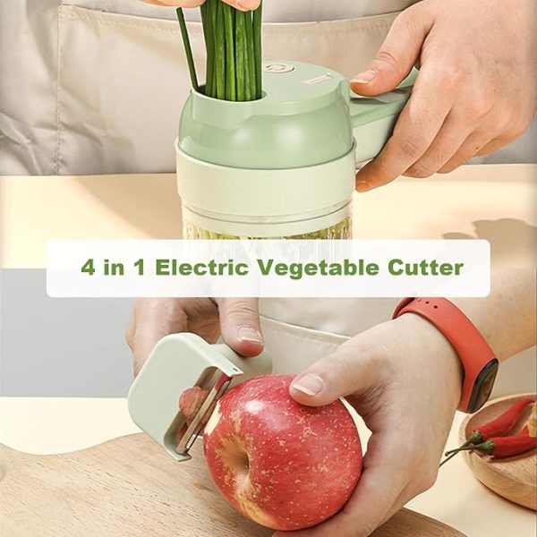 Electric vegetable cutter slicing green onions and peeling a red apple with paring knife attachment