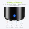 Close-up of a black mini speaker's blue LED button with icons showing charging, pairing, play/pause, and track control functions