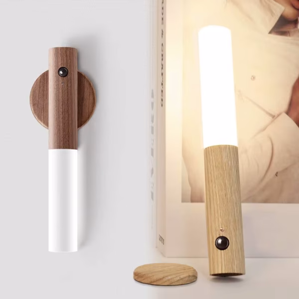 Two-in-one wooden motion sensor night light shown wall-mounted in off mode and detached as a standing desk lamp with warm glow