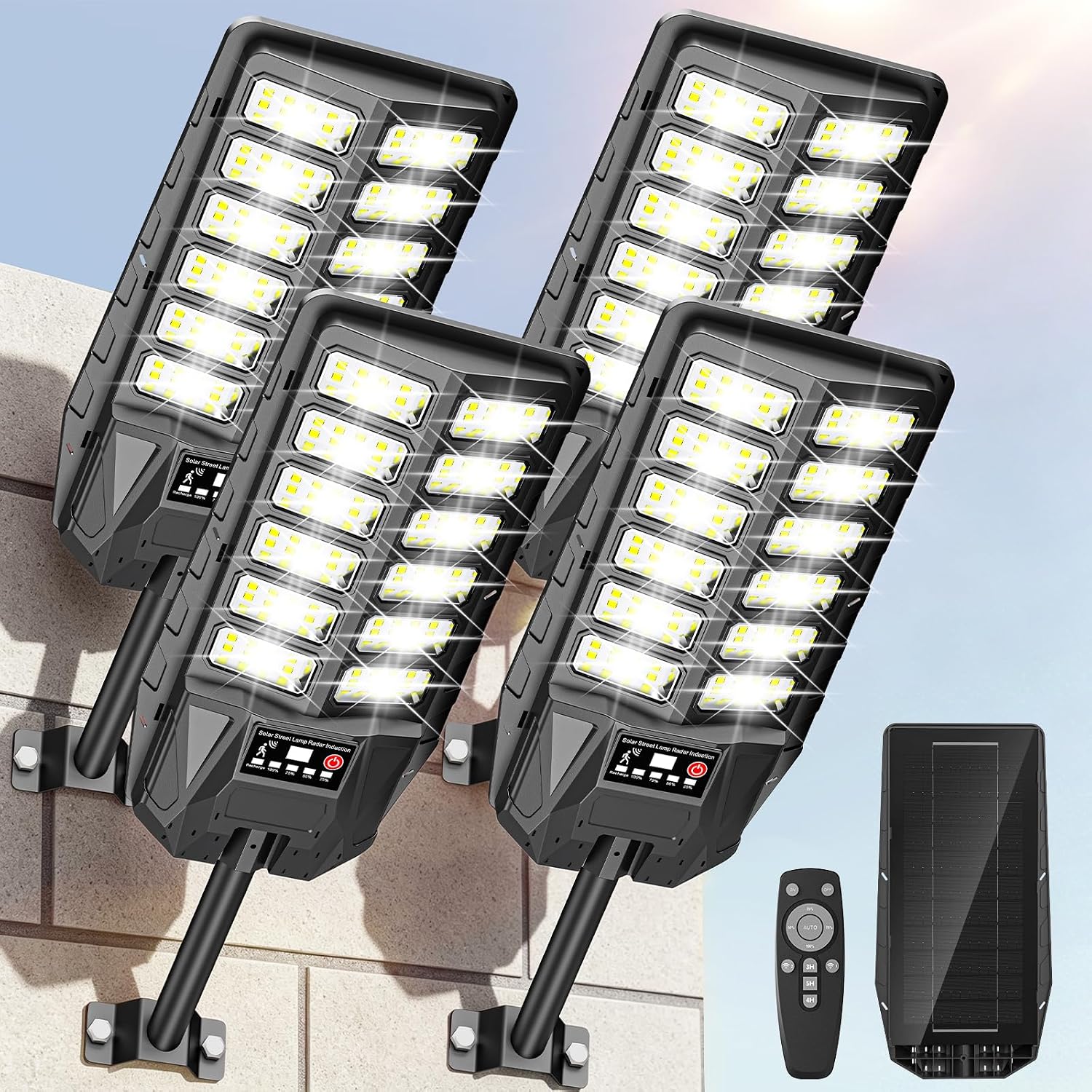 Four outdoor solar lights mounted on a wall with LED panels facing up, shown alongside remote control and solar panel